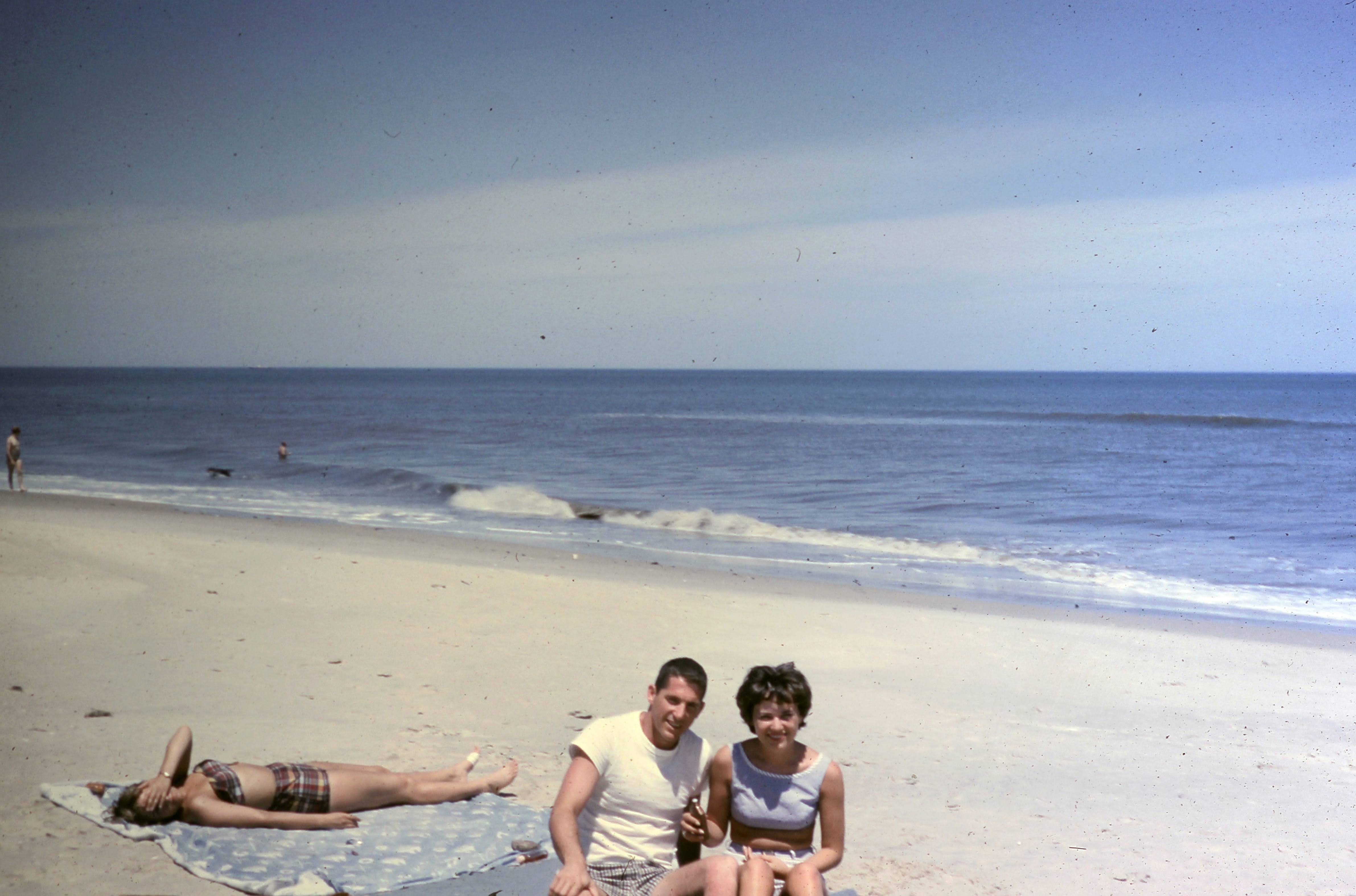 Don and Joy McCool sitting together at the beach.