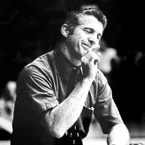 Coach Don McCool, smiling on the sideline.