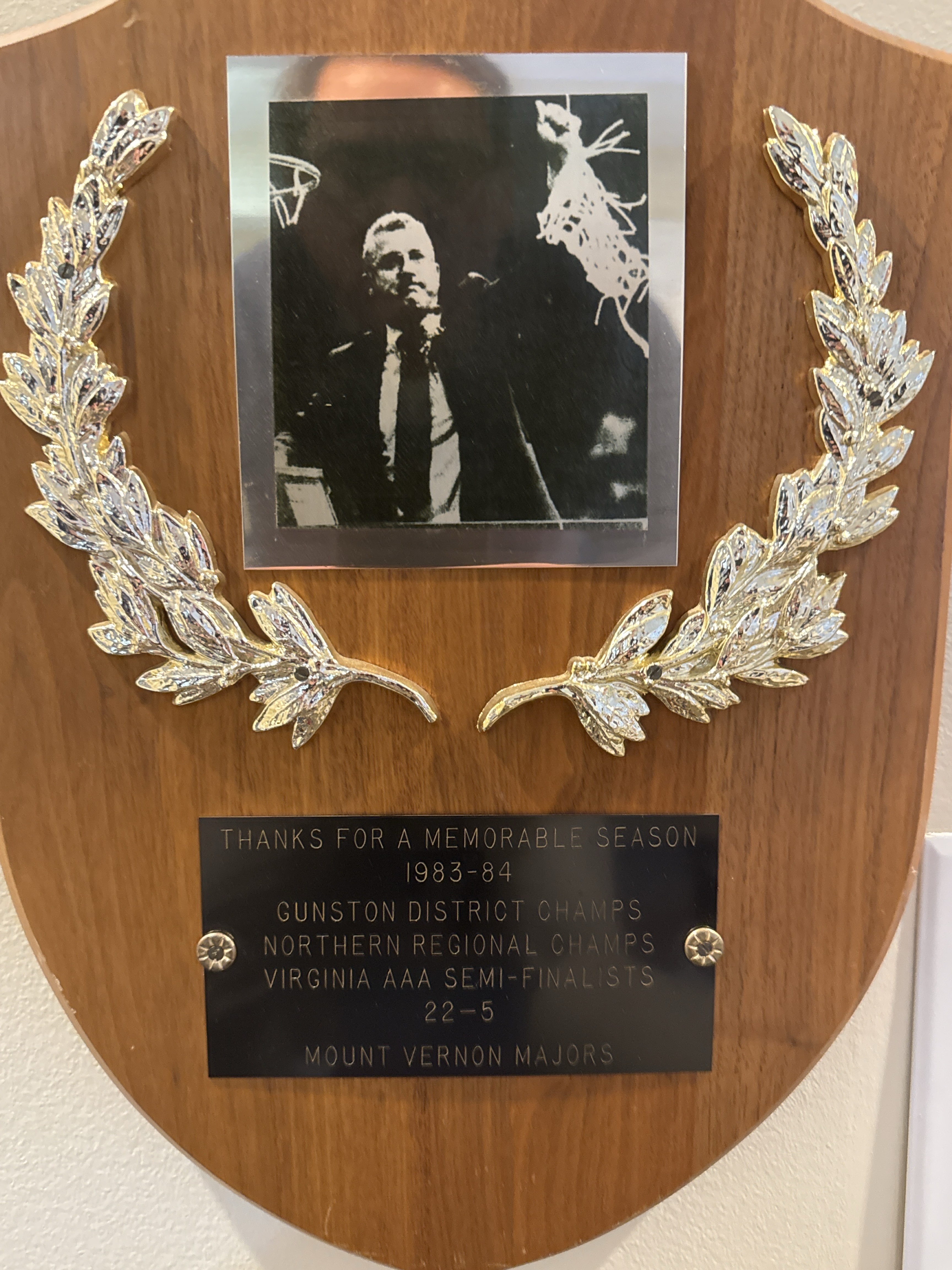 1983-84 Mount Vernon championship plaque showing Coach McCool cutting down the net.